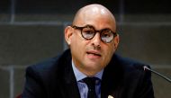 File Photo: Simon Stiell speaks at a news conference during the pre-COP26 climate meeting in Milan, Italy, on October 2, 2021. (REUTERS/Guglielmo Mangiapane)