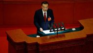 Chinese Premier Li Keqiang speaks at the opening session of the National People's Congress (NPC) at the Great Hall of the People in Beijing, China March 5, 2022. REUTERS/Carlos Garcia Rawlins


