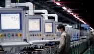 An employee works on the production line of electric vehicle (EV) battery manufacturer Octillion in Hefei, Anhui province, China March 30, 2021. Picture taken March 30, 2021. REUTERS/Aly Song


