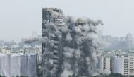 The Supertech Twin Towers collapses following a controlled demolition after the Supreme Court found them in violation of building norms, in Noida, India, on August 28, 2022. REUTERS/ Anushree Fadnavis