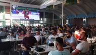 People watch FIBA Basketball World Cup 2023 Asian Qualifiers between Lebanon and India, at a cafe in Dekwaneh, Lebanon, August 29, 2022. (REUTERS/Mohamed Azakir)