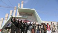 Armed members of the Houthi movement shout slogans as they visit the grave of Houthi senior official Saleh al-Sammad at al-Sabeen Square in Sanaa, Yemen, on January 11, 2021. File 
 Photo / REUTERS