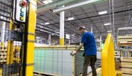 A worker builds a crate for solar panels at First Solar in Perrysburg, Ohio July 8, 2022. REUTERS/Megan Jelinger/File Photo