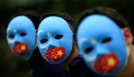Activists take part in a protest against China's treatment towards the ethnic Uyghur people and calling for a boycott of the 2022 Winter Olympics in Beijing, at a park Jakarta, Indonesia, January 4, 2022. (REUTERS/Willy Kurniawan)