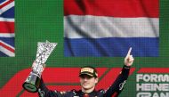 Red Bull's Max Verstappen celebrates on the podium with the trophy after winning the Dutch Grand Prix at the Circuit Zandvoort, in Zandvoort, Netherlands, on September 4, 2022. 
REUTERS/Yves Herman