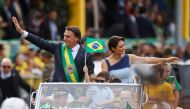 Brazil's President Jair Bolsonaro waves from a vehicle during a military parade to celebrate the bicentennial independence of Brazil, in Brasilia, on September 7, 2022. REUTERS/Adriano Machado