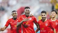 Al Duhail's Michael Olunga celebrates with his team-mates.