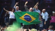 Former President of Brazil and current presidential candidate Luiz Inacio Lula da Silva waves during a rally as he campaigns for the national election, in Taboao da Serra, Brazil, on August 10, 2022. REUTERS/Carla Carniel 