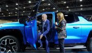 US President Joe Biden steps out of an electric Chevrolet Silverado EV pickup truck during a visit to the Detroit Auto Show to highlight electric vehicle manufacturing in America, in Detroit, Michigan, US, on September 14, 2022. (REUTERS/Kevin Lamarque)
