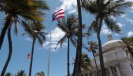 The flags of the US and Puerto Rico fly outside the Capitol building in San Juan, Puerto Rico, on May 4, 2017.  File Photo / Reuters
