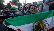 Protestors stand in solidarity with Iranian women after the death of Mahsa Amini, in London on September 24, 2022. REUTERS/Clodagh Kilcoyne/File Photo
 