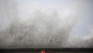 :Children play with waves at the seafront in the aftermath of Hurricane Ian in Havana, Cuba, on September 28, 2022. REUTERS/Alexandre Meneghini