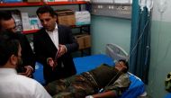 A wounded man lies on a bed of a hospital after he was injured during Iran's Revolutionary Guards struck at militant targets in the Kurdish region of northern Iraq with missiles and drones, in Erbil, Iraq, on September 28, 2022. REUTERS/Azad Lashkari