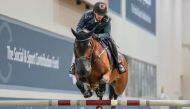 Faleh Suwead Al Ajami guides Steyburn over an obstacle.