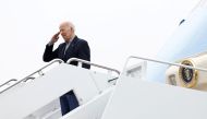 U.S. President Joe Biden salutes as he boards Air Force One upon departure for Florida from Joint Base Andrews in Maryland, U.S., October 5, 2022. REUTERS/Evelyn