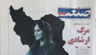 A newspaper with a cover picture of Mahsa Amini, a woman who died after being arrested by the Islamic republic's 
