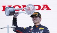 Red Bull's Max Verstappen celebrates winning the race and the championship on the podium Reuters/Issei Kato