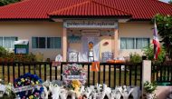 View of a makeshift memorial outside the day care centre which was the scene of a mass shooting in the town of Uthai Sawan, in the province of Nong Bua Lam Phu, Thailand, October 9, 2022. (REUTERS/Jorge Silva)