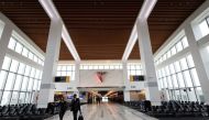 Two Delta Airlines employees walk through a gate area of the Delta Airlines Terminal C at LaGuardia Airport in the Queens borough of New York City, New York, US, on June 1, 2022.  File Photo / Reuters
