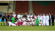 Qatar U17 players and team officials celebrate after qualifying for the AFC U17 Asian Cup on Sunday.