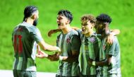Al Duhail's Suhaib Gannan celebrates with team-mates after scoring their second goal.