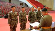 Korean People's Army medics receive awards for their contributions in fighting the Covid-19 pandemic in Pyongyang, North Korea, August 18, 2022. (Korean Central News Agency via REUTERS)