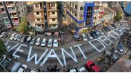 A slogan is written on a street as a protest after the coup in Yangon, Myanmar, on February 21, 2021. Picture taken with iPhone panoramic mode. File Photo / Reuters 
