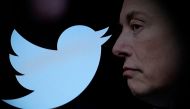 Twitter logo and a photo of Elon Musk are displayed through magnifier in this illustration taken October 27, 2022. REUTERS/Dado Ruvic/Illustration/File Photo