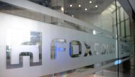 A sign of Foxconn is seen at a glass door inside its office building in Taipei, Taiwan November 12, 2020. REUTERS/Ann Wang/File Photo