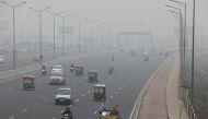 Vehicles are seen on a highway on a smoggy morning in New Delhi, India, December 2, 2021. REUTERS/Anushree Fadnavis/File Photo