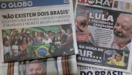 Picture of Brazilian newspapers taken in Rio de Janeiro, Brazil, on October 31, 2022, a day after Luiz Inacio Lula da Silva reclaimed the presidency in a run-off election. (Photo by Pablo PORCIUNCULA / AFP)