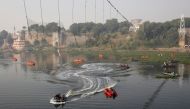 Rescuers conduct search operation after a suspension bridge collapsed on Sunday, in Morbi town in the western state of Gujarat, India, November 1, 2022. REUTERS/Stringer