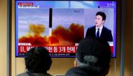 People watch a TV broadcasting a news report on North Korea firing a ballistic missile off its east coast, in Seoul, South Korea, November 3, 2022. (REUTERS/ Heo Ran)