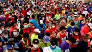Participants wait before the start of the Beijing Marathon, the first in two years after being canceled in 2020 and 2021 because of the coronavirus disease (COVID-19), in Beijing, China November 6, 2022. REUTERS/Tingshu Wang