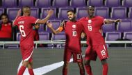 Qatar players celebrate during a match, in this file photo.