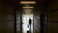 File Photo: A teacher walks the divided hallways at Hunter's Glen Junior Public School, part of the Toronto District School Board, in Scarborough, Ontario, Canada, September 14, 2020. (Nathan Denette/Pool via REUTERS)