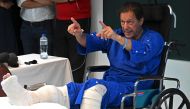 In this picture taken on November 4, 2022, Pakistan's former prime minister Imran Khan addresses the media representatives at a hospital in Lahore. (AFP/Arif Ali)