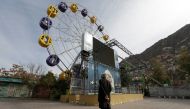 An Afghan man stands in an amusement park in Kabul, Afghanistan, on November 9, 2022. REUTERS/Ali Khara