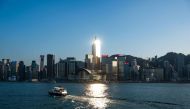 A boat crosses Victoria Harbour in Hong Kong on November 10, 2022. (Photo by Bertha WANG / AFP) 