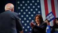 US Vice President Kamala Harris applauds President Joe Biden during an event hosted by the Democratic National Committee to thank campaign workers, at Howard Theatre in Washington, DC, November 10, 2022. (Photo by Mandel NGAN / AFP)