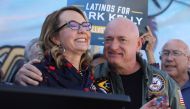 US Senator Mark Kelly (D-AZ) and his wife Gabby Giffords, a former member of the United States House of Representatives, declares victory in his re-election campaign against Republican challenger Blake Masters in the US midterm elections in Phoenix, Arizona, US, November 12, 2022. (REUTERS/Jim Urquhart)