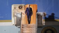 US President Joe Biden disembarks from Air Force One upon arrival at Ngurah Rai International Airport in Denpasar on the Indonesian resort island of Bali, November 13, 2022, as he travels to attend the G20 Summit. (Photo by Made NAGI / POOL / AFP)