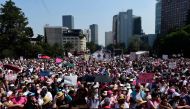 Demonstrators take part in a march against possible government measures to restructure the National Electoral Institute (INE), in mexico City on November 13, 2022. (AFP/ Claudio Cruz)

