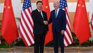 US President Joe Biden (R) and China's President Xi Jinping (L) meet on the sidelines of the G20 Summit in Nusa Dua on the Indonesian resort island of Bali on November 14, 2022. Photo by Saul Loeb / AFP