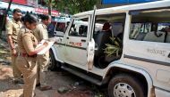 Police officers examine a vehicle that was damaged during a clash with protesters at a police station near the proposed Vizhinjam Port in the southern state of Kerala, India, November 28, 2022. REUTERS/Stringer