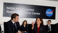 US Vice President Kamala Harris (right) and French President Emmanuel Macron attend a meeting on French-US cooperation in Space, at NASA headquarters in Washington, DC, on November 30, 2022. (Photo by Ludovic MARIN / AFP)
