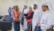 Officials distributing hygiene kits to workers.