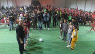 People come together to watch FIFA World Cup Qatar 2022 matches at a fan zone set up at Zaatari camp in Jordan under  #Qatar2022ForAll initiative.
