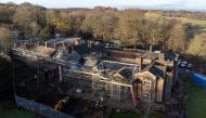 An aerial view shows Hopwood Hall, the ancestral home of US film producer Hopwood DePree, that dates from the 15th century, which he is in the process of restoring, in Middleton, northern England on November 28, 2022. Photo by OLI SCARFF / AFP