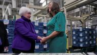 US Treasury Secretary Janet Yellen holds the hands of US Treasury Chief Lynn Malerba as she presides over the unveiling of the first US banknotes printed with two women's signatures at an event in Fort Worth, Texas, US, December 8, 2022. (REUTERS/Shelby Tauber)